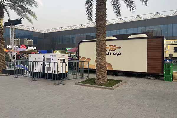 outdoor silent diesel generator providing power to a mobile unit