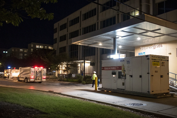 Emergency diesel generator outside hospital at night