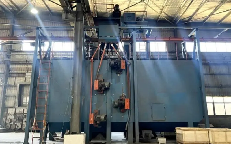 Sand blasting machine preparing steel fabrications before coating at H&C factory