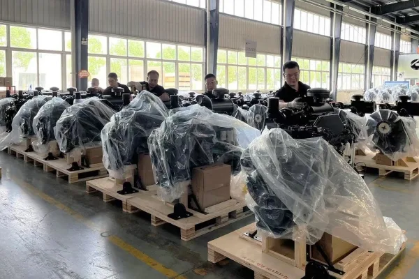 Multiple heavy-duty diesel engines packed in crates, ready for export to global mining and marine projects.